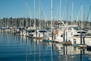 white boat docked under blue sky